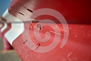 white and red guardrail on a road