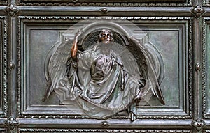 Detail of the Pieta scene in bas-relief at Milan`s Cathedral doors