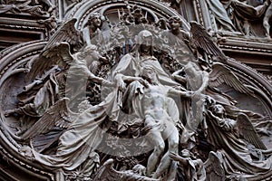 Detail of the Pieta scene in bas-relief at Milan's Cathedral doors,