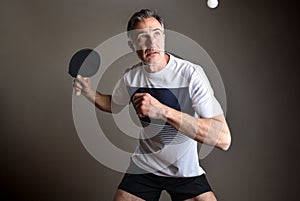 Detail of ping-pong player going to hit a ball isolated