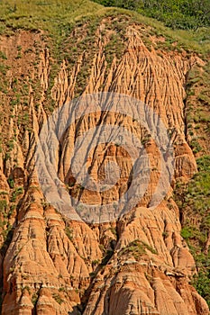 Detail of the pink rocks Rapa Rosie , the grand canyon of Romania, under a clear blue sky