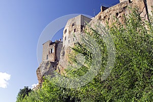 Pitigliano, one of the best town in Tuscany, Italy. Panoramic view from a path in a forest sorrounding the city.