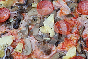 detail of pizza called capricciosa with mushrooms artichokes spi