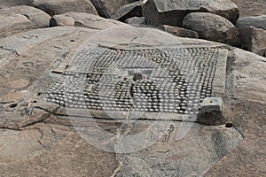 Detail of a plant of a temple carved into the rock. Hampi, India. photo