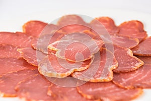 Plate of slices of iberian pork loin sausage