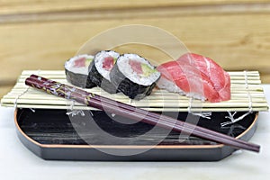 Detail of a plate with sushi and sashimi.