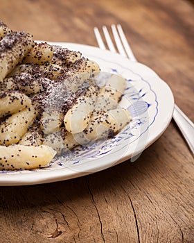 Detail of poppy seed noodles on a plate