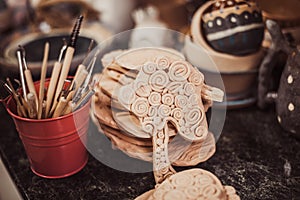 Detail from pottery work room - brushes and tools