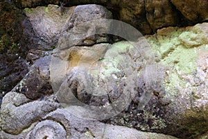 Detail of a praying angel on old stone altar