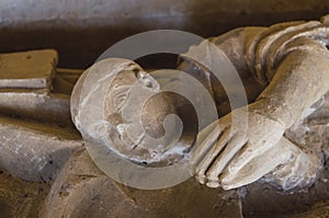 detail of a praying figure on the tombstone of Santo Domingo de Silos photo