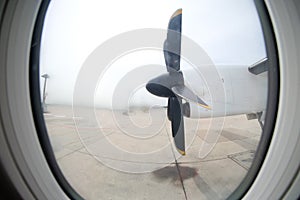 Detail of the propeller airplane at the airport