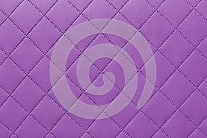 Detail of purple sewn leather, pink leather upholstery background pattern