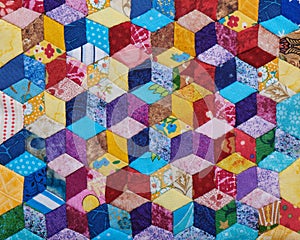 Detail of quilt sewn from diamonds and has view three-dimensional