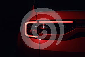 Detail on the rear light of a car. Car detail. Developed Car`s rear brake light