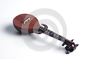 Detail of rebab, arabic musical instrument, isolated on white background. Flat lay photo