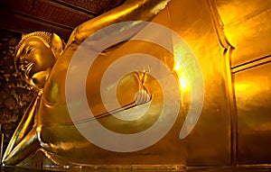 Detail of the Reclining Buddha statue at the Wat Pho temple.