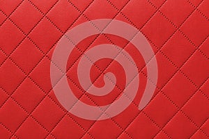 Detail of red sewn leather, gray leather upholstery background pattern