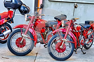 detail of red two old motorbike