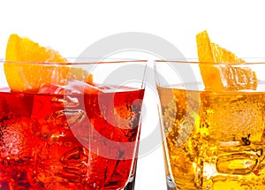 Detail of red and yellow cocktail with orange slice on top isolated on white background