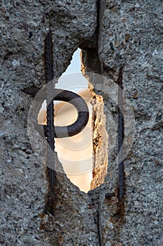 Close up of the crumbling remains of the Berlin Wall at the Wall Memorial, Germany. Segments of wall have been left as a reminder