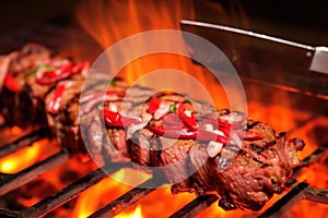 detail of removeable blade slicing grilled lamb kebab