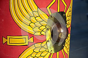 Detail of a reproduction Roman scutum shield with red and yellow photo