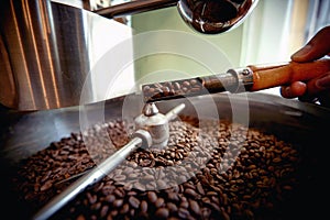 detail of roasting and mixing whole grain coffee