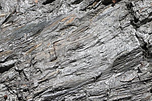 Detail of rock structure. Orthogneiss and gneiss rock. Stone background.