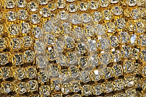 Detail of a roll of golden necklaces with precious stones set fo