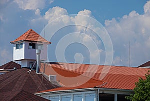 detail of roof of the house against blue sky