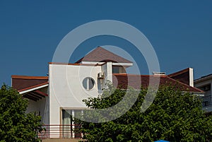 detail of roof of the house against blue sky