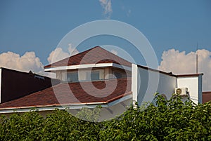 detail of roof of the house against blue sky