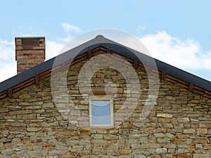 Detail of  the roof of an old stone country house