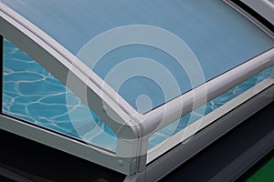 Detail of roof retractable swimming pool enclosures