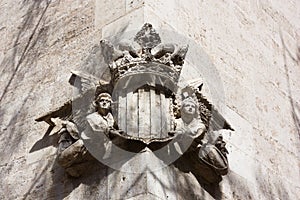 Detail of the royal coat of arms of the Plaza del Mercado on one side of the Lonja de la Seda in Valencia Spain photo
