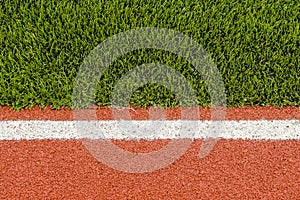 Detail of running track rubber lanes with the artificial grass