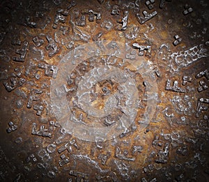 Detail of the rusty pattern from a manhole cover