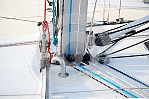 Detail of sailboat mast bottom with ropes