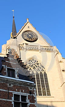 Detail of Saint Peter`s Church and a brick ancien house on a sunny day, Leuven, Belgium photo