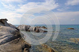 Detail of the sandy beach and rocks of Karidi