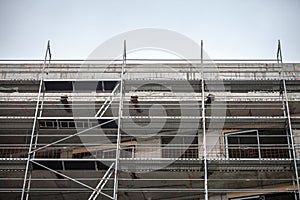 Detail of a Scaffolding on a residential skyscraper construction site in Belgrade, Serbia, on a sunny afternoon