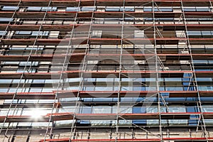 Detail of a Scaffolding on a skyscraper construction site in Belgrade, Serbia, on a sunny afternoon