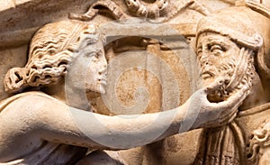 Detail of sculpture carved on marble showing woman touching manÃÂ´s beard