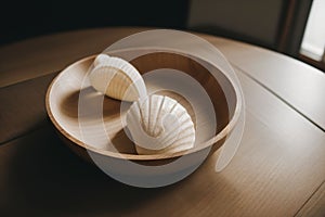 Detail of a seashell necklace on a wooden table