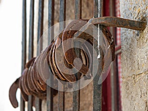 Detail of several old horseshoes hanging from a window 3.