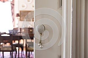 Detail shot of antique knob on pocket door in historic house