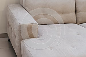 Detail shot of a beige couch in a living room