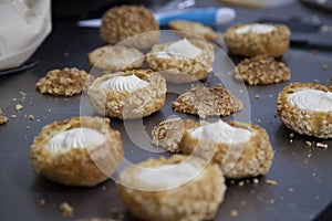 Choux dough with craquelin on a table. photo