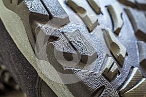 Detail shot of fragmrnt of new fashionable hiking mountain boot.