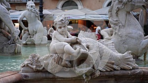 Detail shot of Rome 16th-century marble Neptune Fountain - Fontana del Nettuno on Piazza Navona, depicting mythological